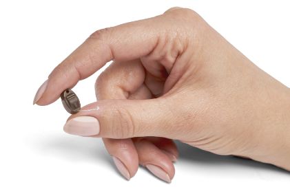 CIC hearing aid in a hand