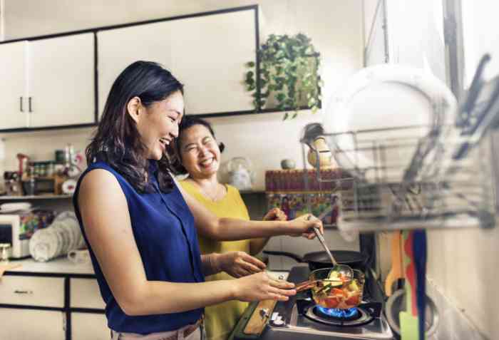 mother and daughter washing dishes