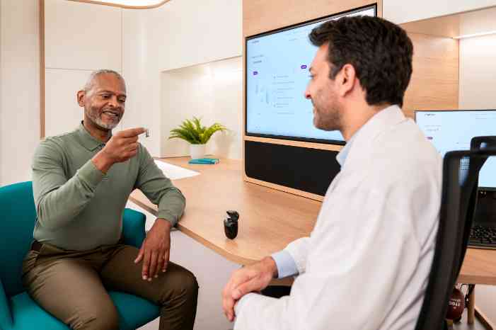 hearing care professional at store