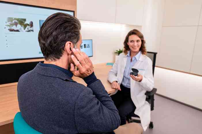hearing care professional with customer
