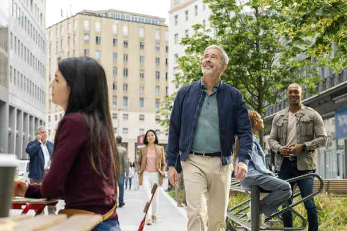 patient shaking hands with hearing care professional