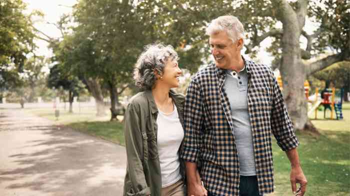 older couple walking through the park