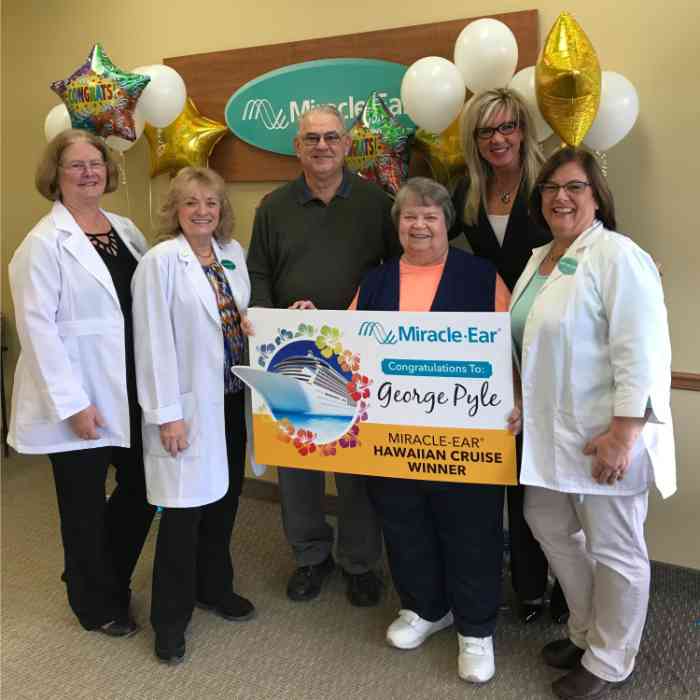 Cruise winner George Pyle with wife Carol and Miracle-Ear staff