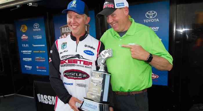 Bassmaster father and son duo with their award
