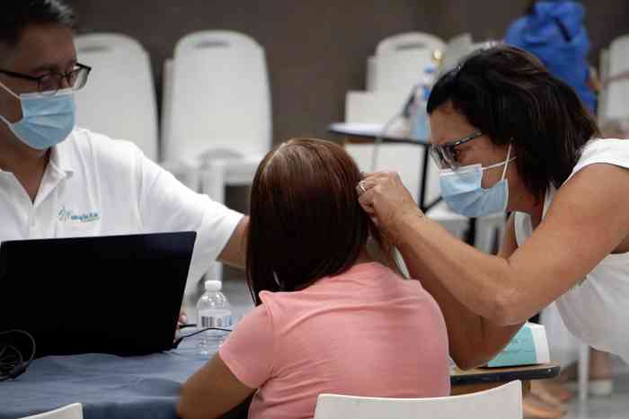 Hearing aid fitting on a little girl's ear
