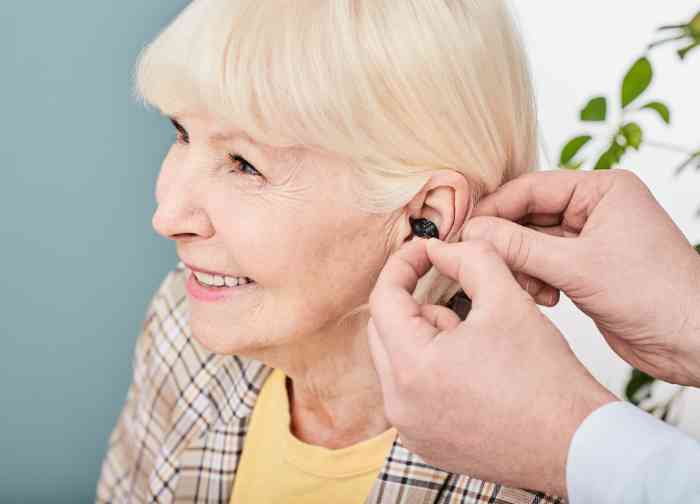 woman being fitted for hearing aids