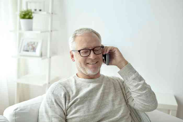 Elderly man speaking on the phone