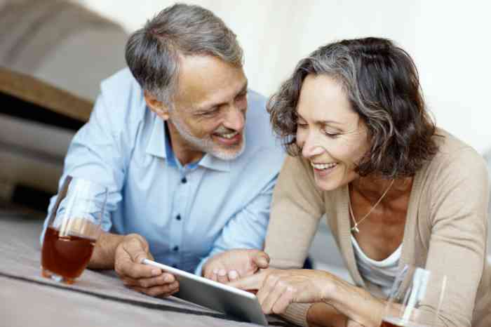 Elderly couple looking at a tablet