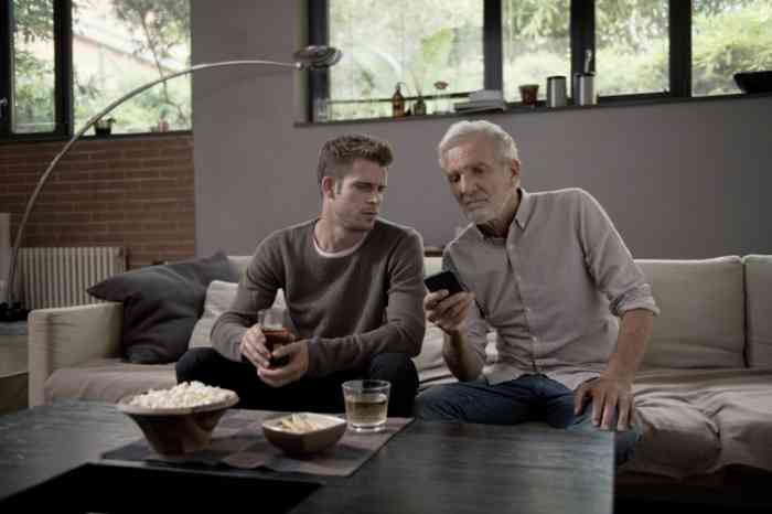 Grandfather and grandson on couch on the app