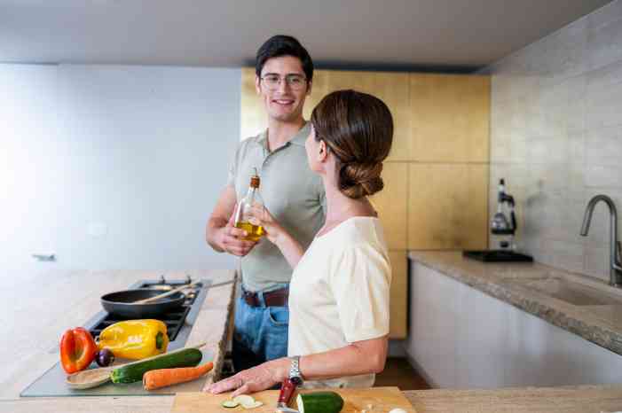 female client male caregiver cooking
