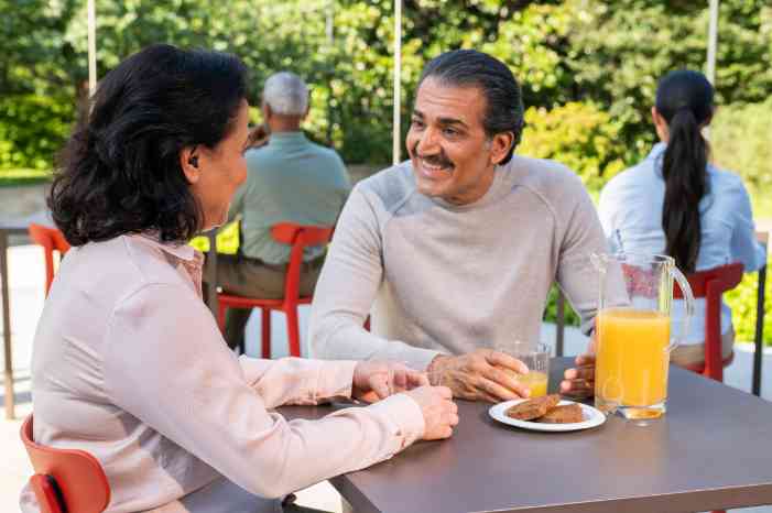 Couple having a conversation over breakfast