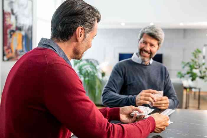 couple of men playing cards