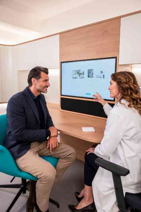 female audiologist and client