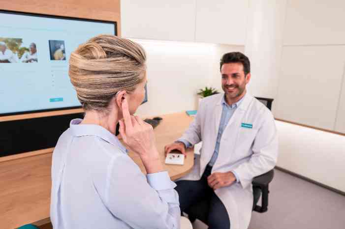 female client and male audiologist