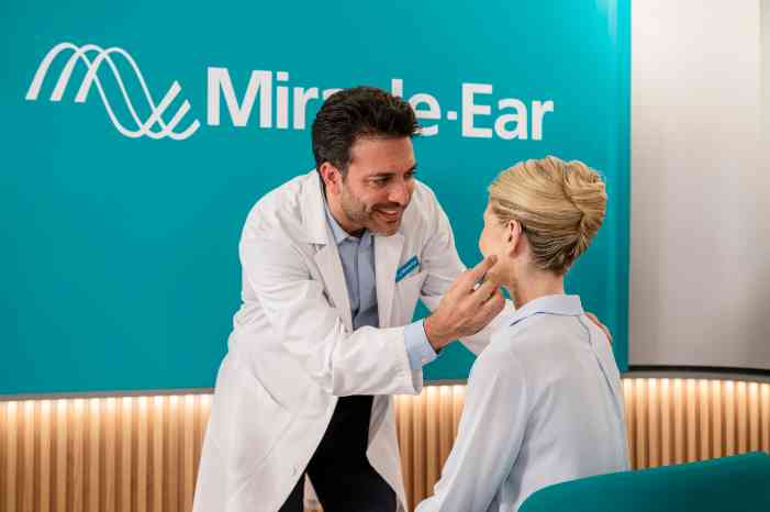 male audiologist put ha energy female