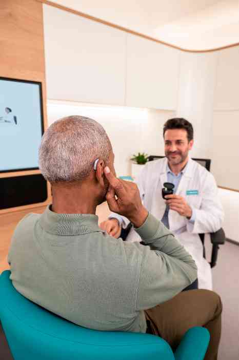 male client and male audiologist in store