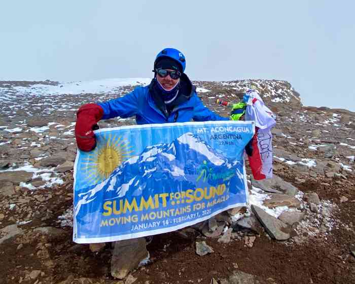 Julie McKelvey at the summit of Mt. Aconcagua