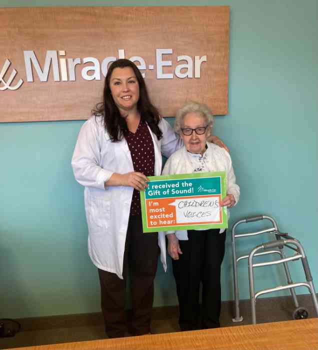 Boy getting hearing aid fitted