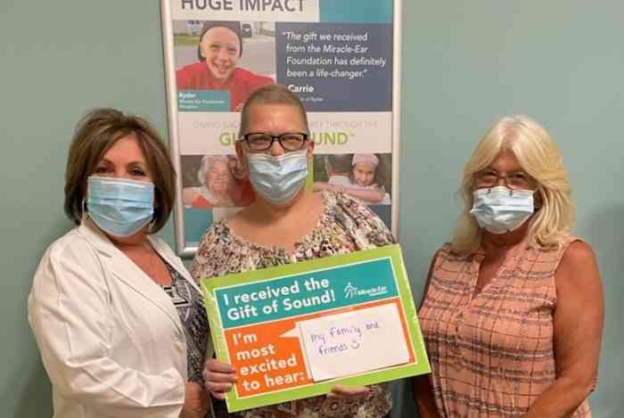 Gift of Sound recipient with caregiver and HCP