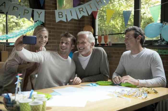 A family taking a selfie during a birthday party
