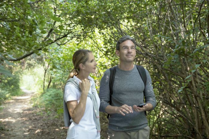 A couple walking in a wood