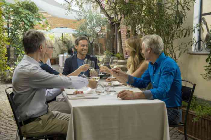 Friends toasting during lunch in a restaurant