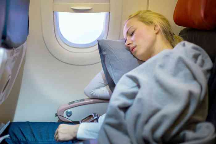 Woman sleeping on a plane