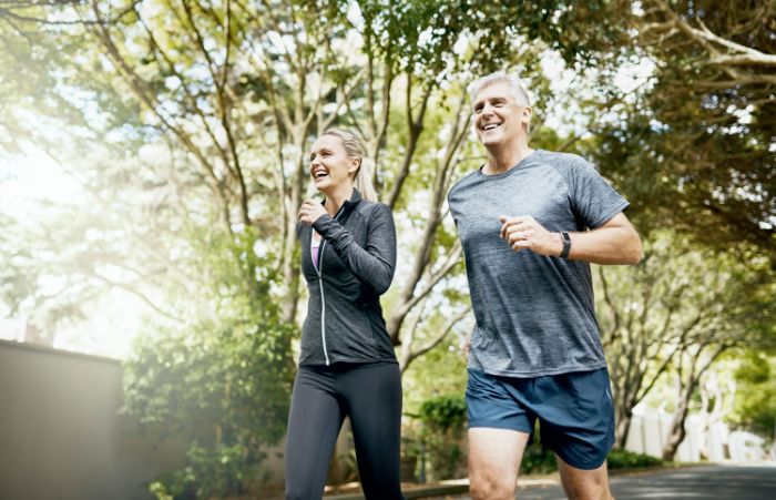 A couple running in a park