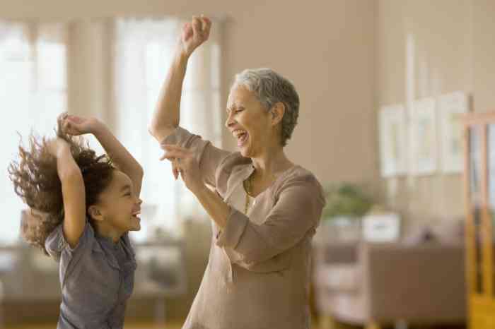 Grandmother and granddaughter dancing