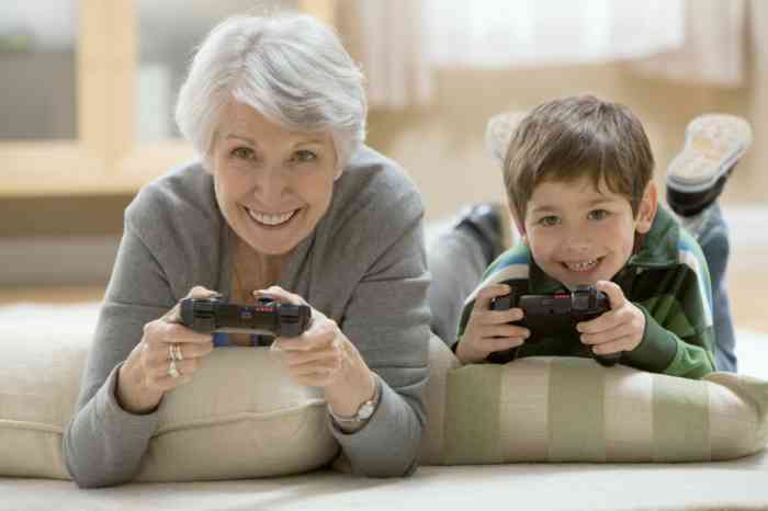 Grandmother and grandson playing videogames