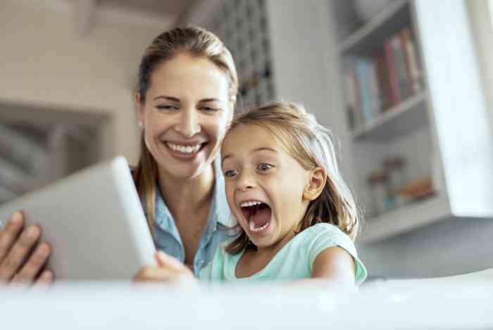 Mother and doughter looking at a tablet