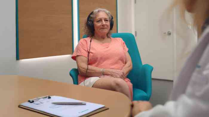 Debra taking hearing test