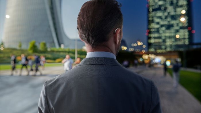 Man wearing rechargeable hearing aids