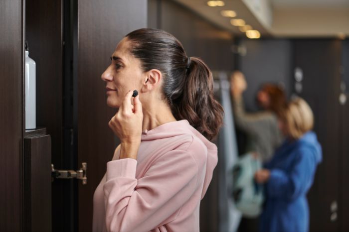 Small hearing aids worn at the gym