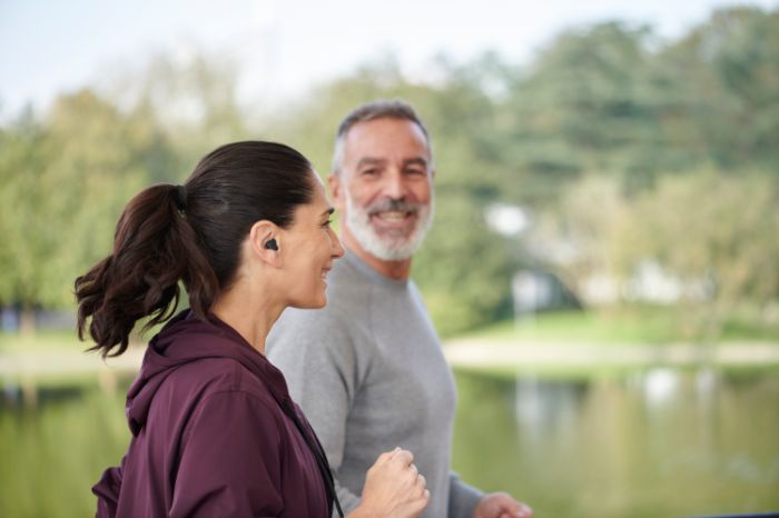 Couple jogging near a river