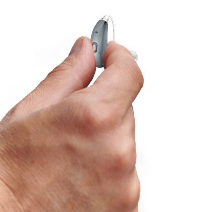 BTE hearing aid in a hand