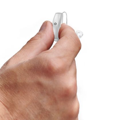 RIC hearing aid in a hand