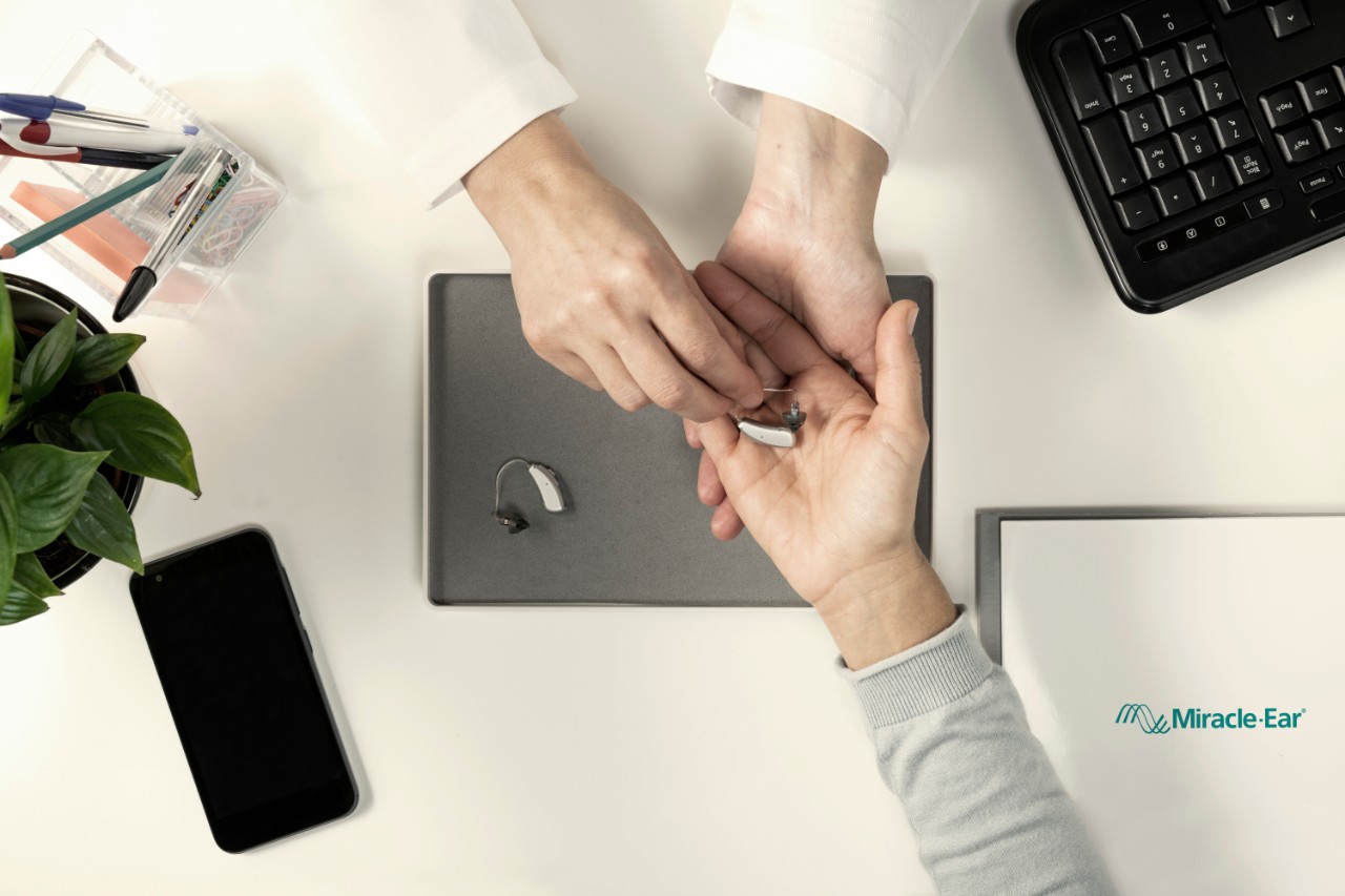 hearing care professional with customer