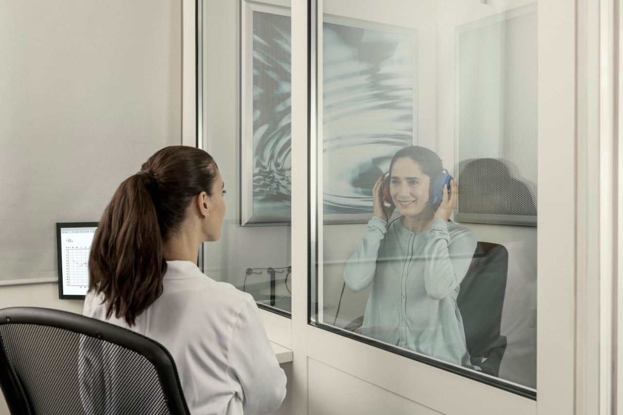 Woman with headphones during a hearing test