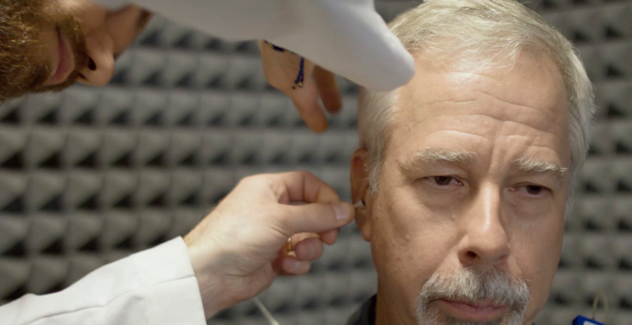 Man taking a hearing evaluation