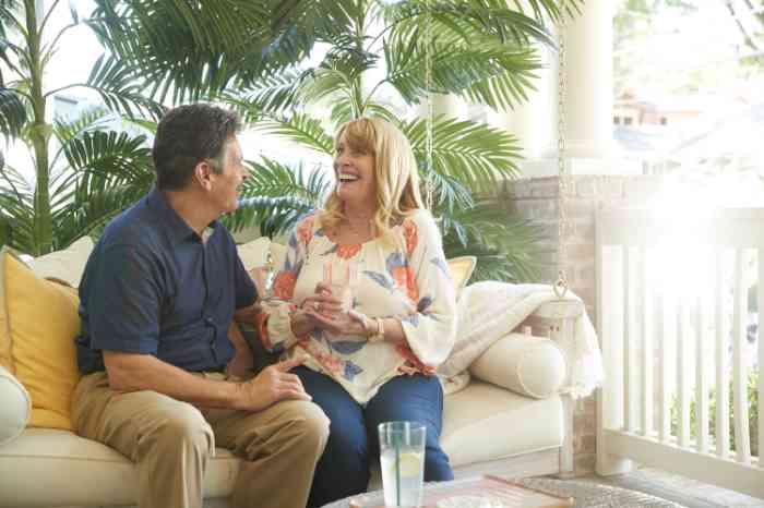 Miracle-Ear customer sitting outside with her husband