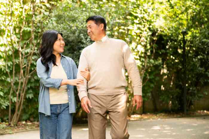male client and female audiologist in the park