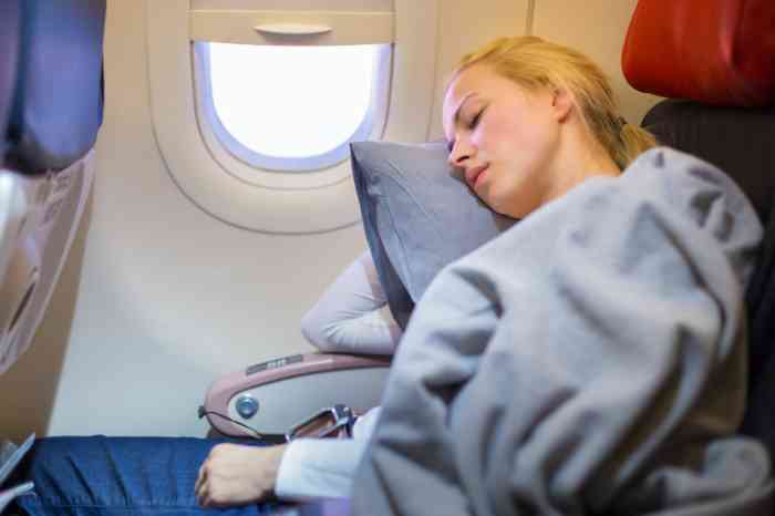 Woman sleeping on plane