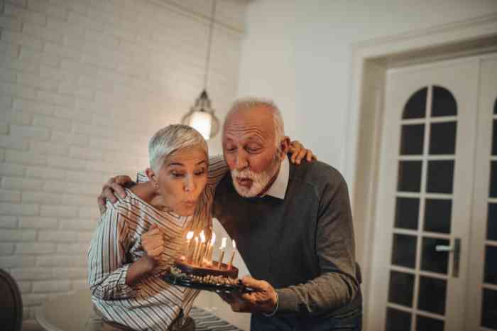 Man with BTE hearing aid having dinner with friends in a restaurant