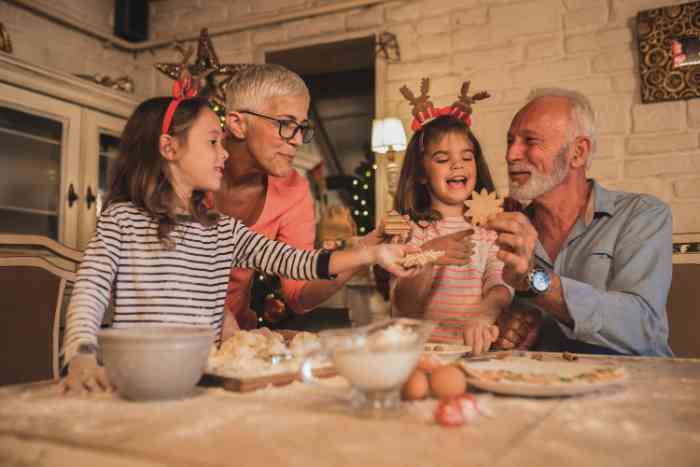 grandparents baking cookies with granddaughters