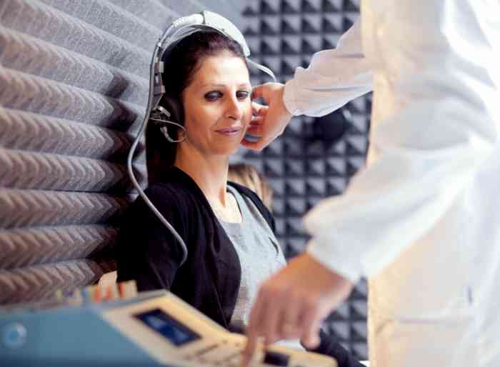 Woman checking her hearing health