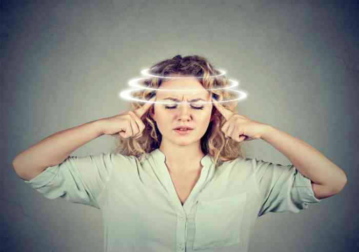 Woman experiencing vertigo