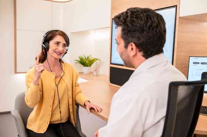 Audiologist performing a hearing test