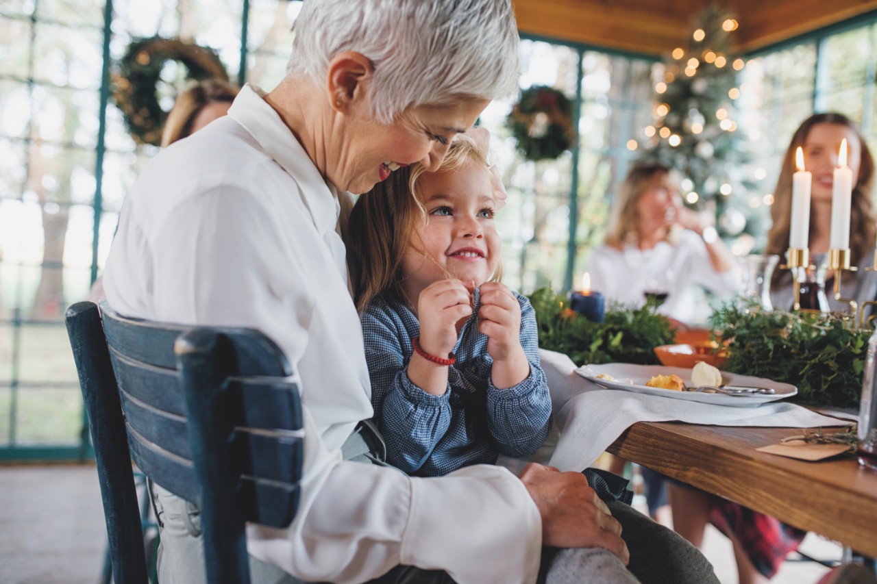 grandmother & grandchild sitting at the dinner table